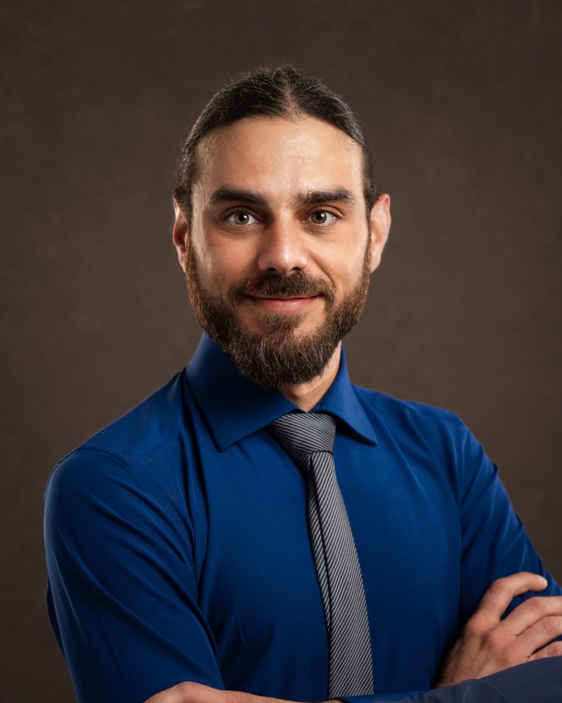 Smiling man in blue shirt